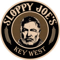 3.5-inch round Sloppy Joe’s sticker with a black and cream portrait of Ernest Hemingway over gold engraved lines, framed by “Sloppy Joe’s” and “Key West” lettering