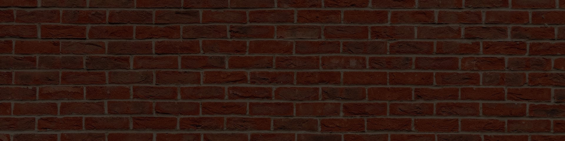 Brick wall with a dark brown color